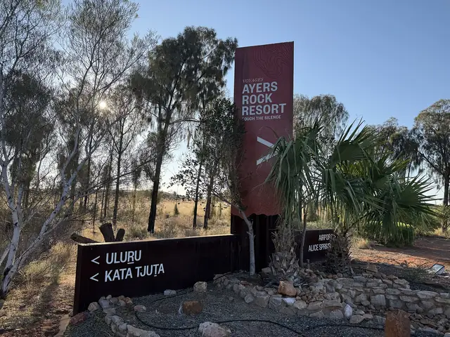 The main road entry to Ayers Rock Resort at Yulara, where hire cars are collected